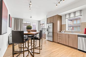Kitchen with stainless steel refrigerator